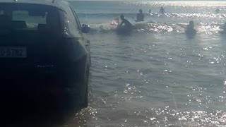 Car Gets Stuck on the Beach