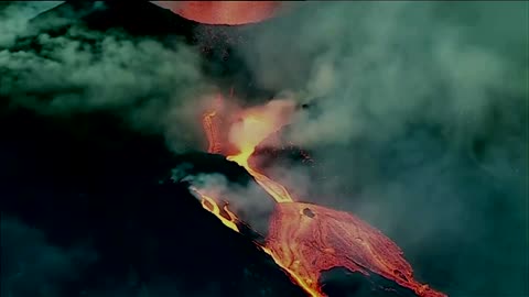 La Palma volcano spews red hot lava