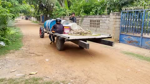 #79-driver tractor go transport water at the river