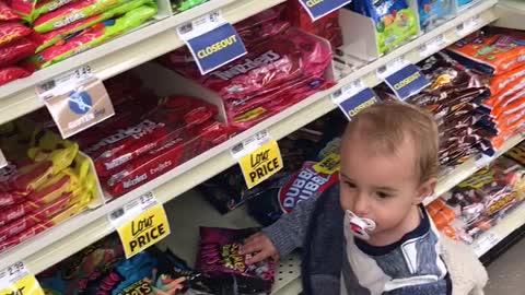 Baby has a sweet tooth while food shopping