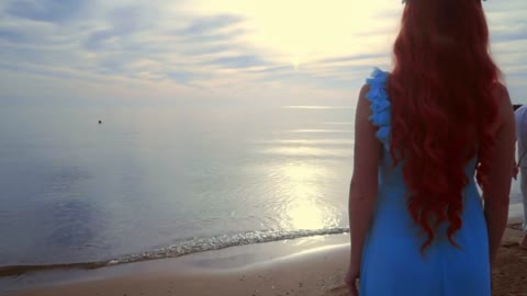 standing on beach at sunset