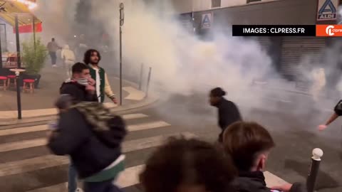Paris — French police use tear gas to try to disperse rioters wanting to attack