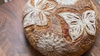 Timelapse of stenciling butterflies and flowers on sourdough