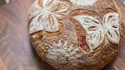 Timelapse of stenciling butterflies and flowers on sourdough