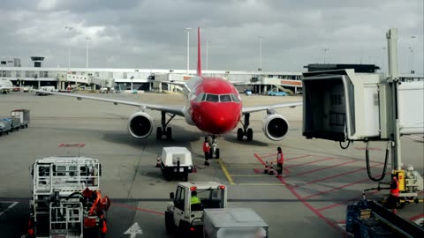 Plane arriving to an airport terminal