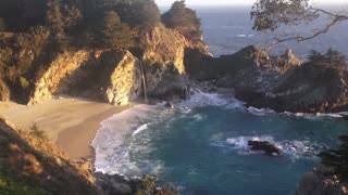 Relaxation Video of a Waterfall on an Ocean Beach at Sunset