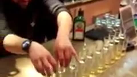An amazing waiter prepares 13 Jager bombs at once