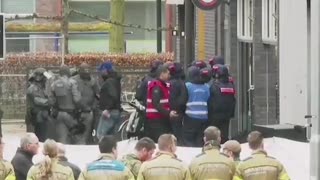 migrant armed with guns and explosives has taken hostages at a nightclub in Ede, the Netherlands.
