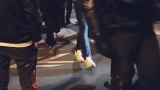 Number of police officers have removed their helmets and are marching with the people in Paris