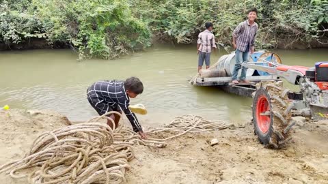 #79-driver tractor go transport water at the river