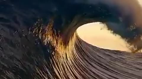 Perfect wave touching the clouds