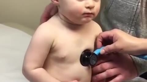 Lovely Sweet Baby Boy Rests Head On Nurse's Hand