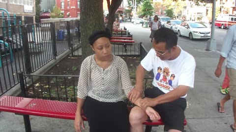 Luodong Massages Young Girl On Sidewalk Bench