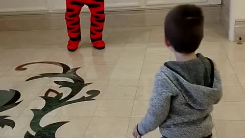 3 year old has a jump off battle with Tigger at Disney World