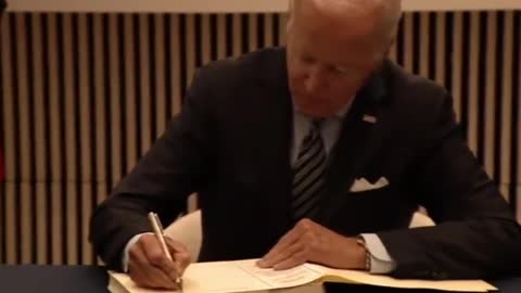 Joe Biden Caught Pulling Out Card and Copying It Infor the Condolence Book for Queen Elizabeth