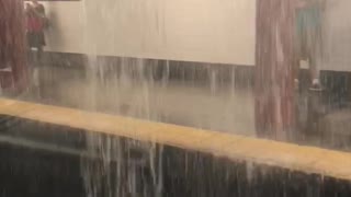 Water rushing into subway rail tracks