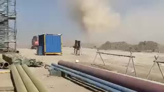 Dust Devil Sweeps Through Worksite