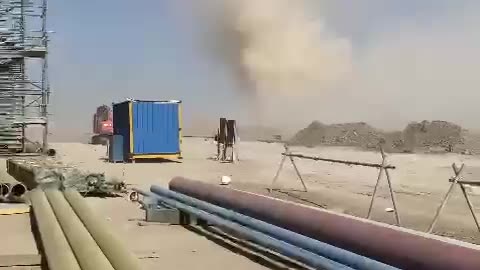 Dust Devil Sweeps Through Worksite