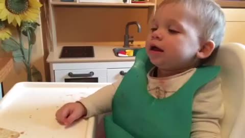Baby tries his best to stay awake during dinner