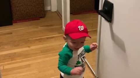 Toddler checks out his appearance
