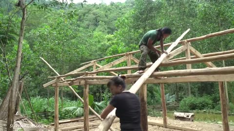 How to build a house from wood, with your wife and children roofed with green corrugated iron tiles