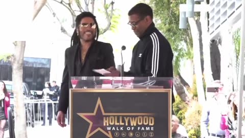Denzel Washington jokes with Lenny Kravitz about sexual relations as Lenny receives his star