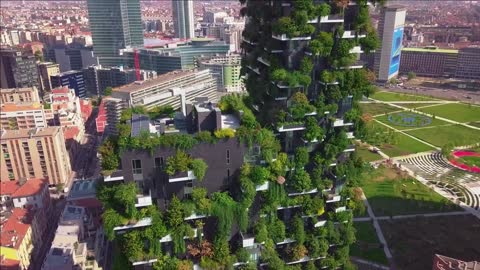 aerial view modern and ecologic skyscrapers with many trees on every balcony