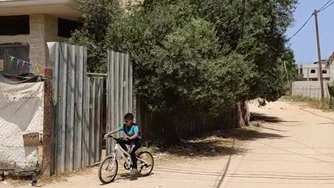 little boy riding a bike