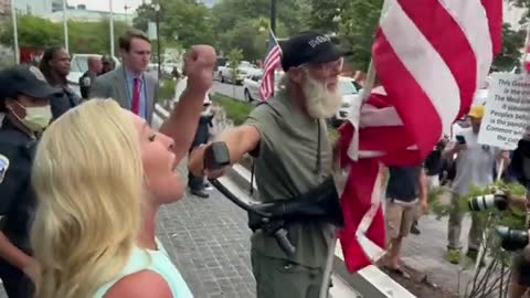 MTG walks right up to anti-Trump protesters and grabs a megaphone...