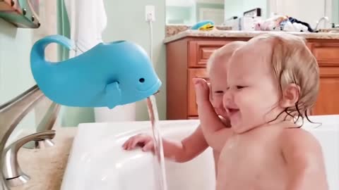 Cute babies trying to drink water.