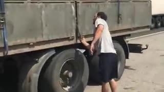 Angry truck driver unloads grain