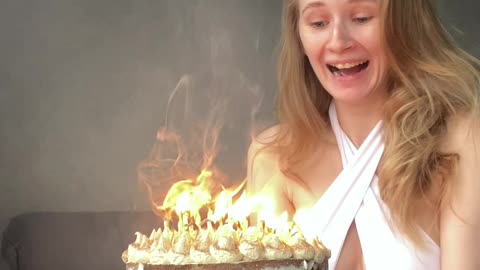 Trick Candles Cover Birthday Cake In Smoke