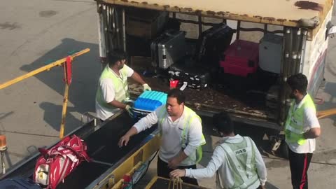 Hong Kong Airport Employees Toss Luggage Carelessly