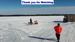 Lake Nosbonsing Ontario Canada - Drilling holes on ice for Fishing - Ariel view