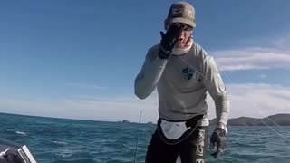 Man on boat in ocean gets hit by fishing pole