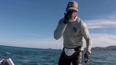 Man on boat in ocean gets hit by fishing pole