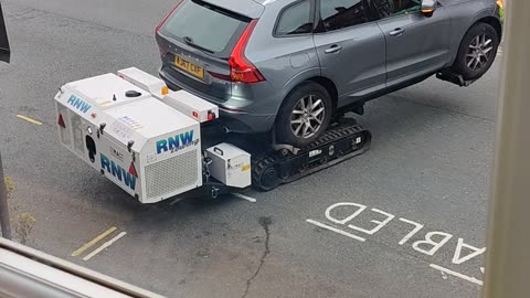 Robot Removes Car From Disabled Parking