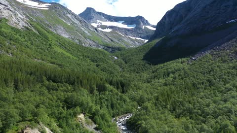 Flying Along Green Valley in The Mountain