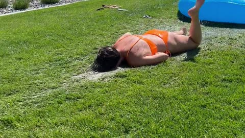 Woman Bellyflops Off Slip-and-Slide