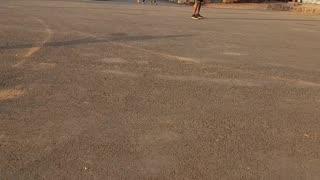 A random guy playing football on the street