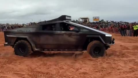 Cybertruck With Paddle Tires in the Sand