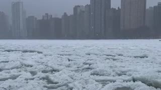 Chicago lake front nearly freezes over during winter storm