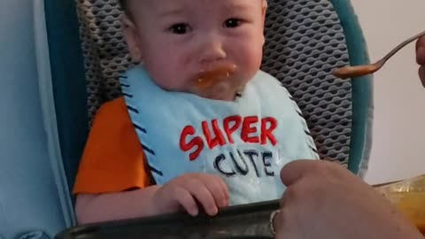 Cute Baby tricked into eating