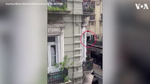 Woman Escapes Fire by Sliding Down a Cable in Buenos Aires| VOA News