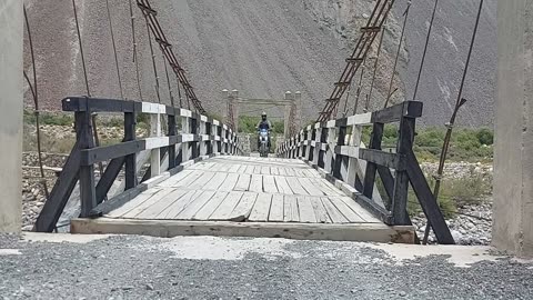 Crossing Wooden Bridge in Shimshal Valley Pakistan
