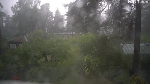 Flash of Lightning Strikes in Backyard on Rainy Day