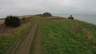 Hiking on path on top of cliff. Overlooking the solent sea. Speedlapse