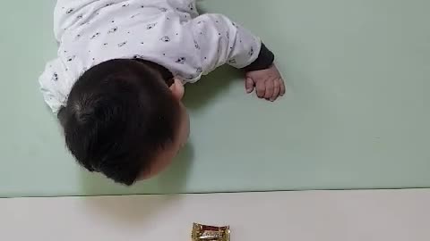 It's a baby who practice hard to crawl.