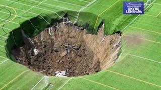 Footage captures the moment a 100 foot wide and 30 foot deep sinkhole swallows a soccer field