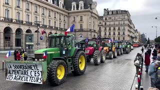 French farmers block roads, dump produce near Paris